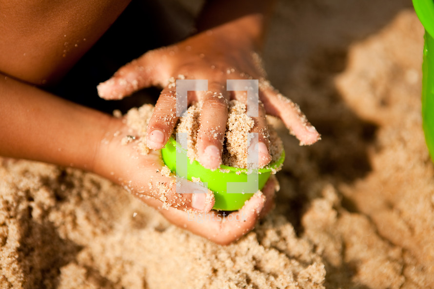 child playing in sand 