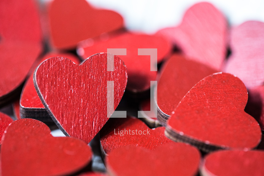pile of red wooden hearts 