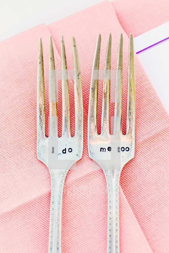 Two engraved forks on pink napkin I do me too wedding 