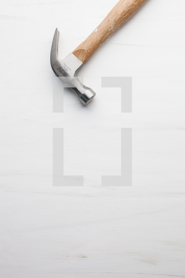 Hammer at the top of a white background.