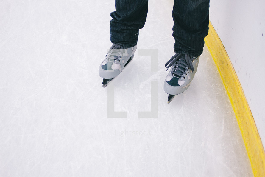 child's feet in ice-skates 