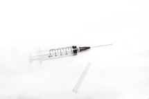 medical syringe with needle on an isolated white background with copy space
