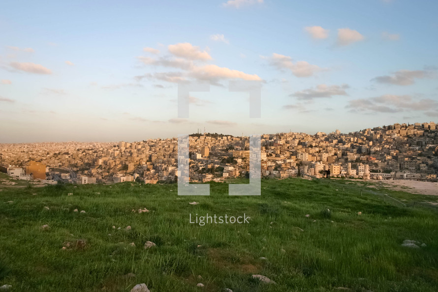 green grass and view of Amman, Jordan