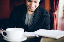 man reading a Bible at a bible study