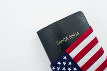 Spanish Holy Bible wrapped in an American flag.