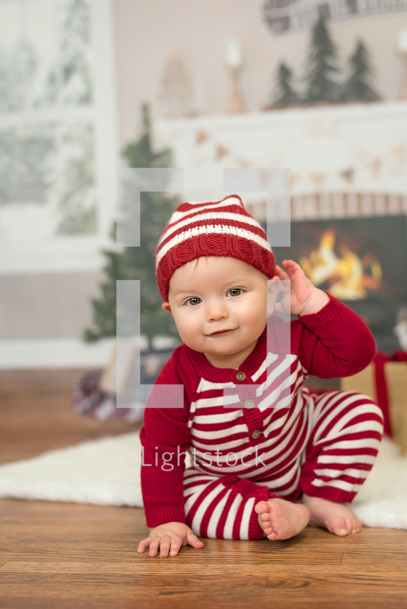 infant in Christmas pajamas 