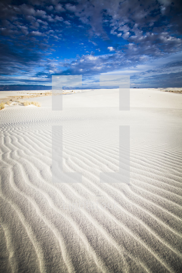 ripples in sand and blue sky