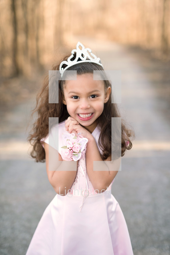 a little girl in a tiara 