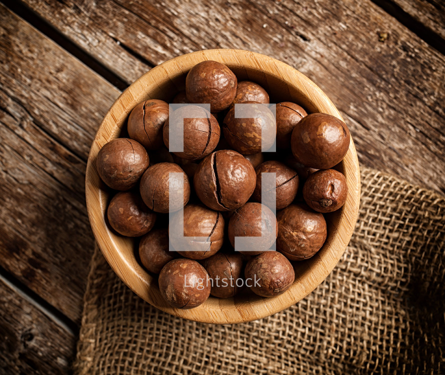 macadamia nuts on wooden table