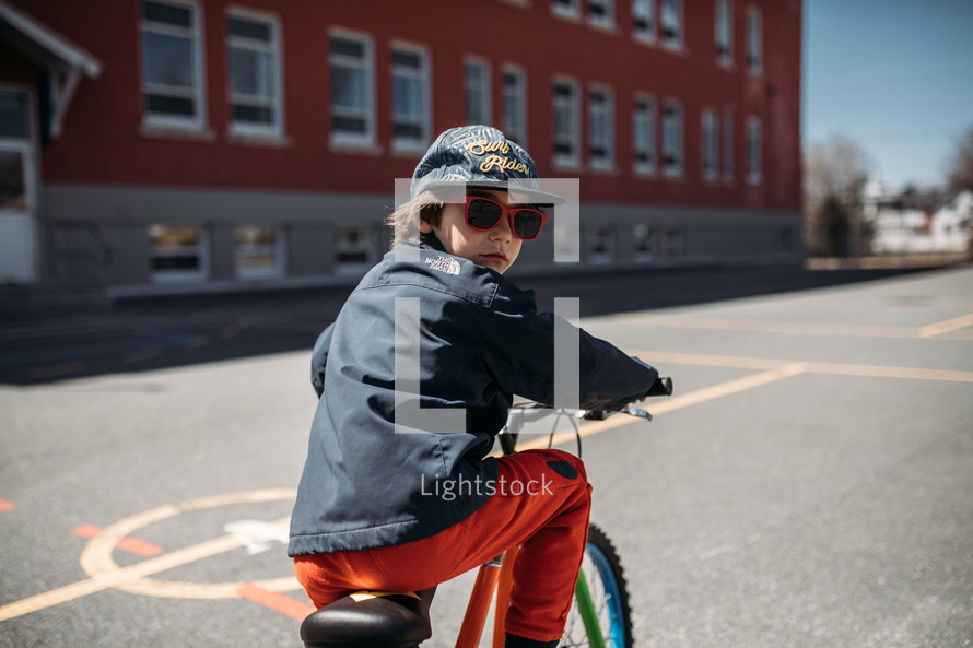 child riding a bike to school