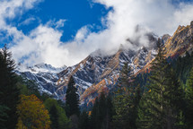 Foggy and rocky peaks in autumn