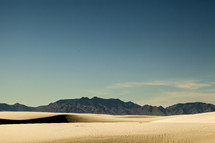 sand dunes and mountain peaks 