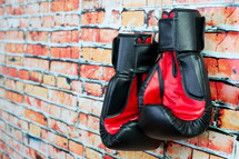 boxing gloves and a brick wall 
