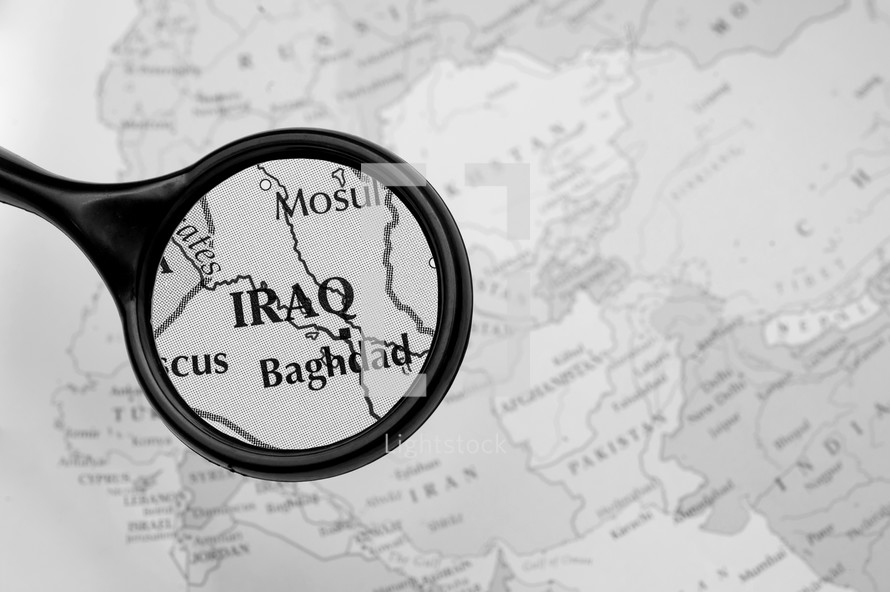 magnifying glass over a map of Iraq