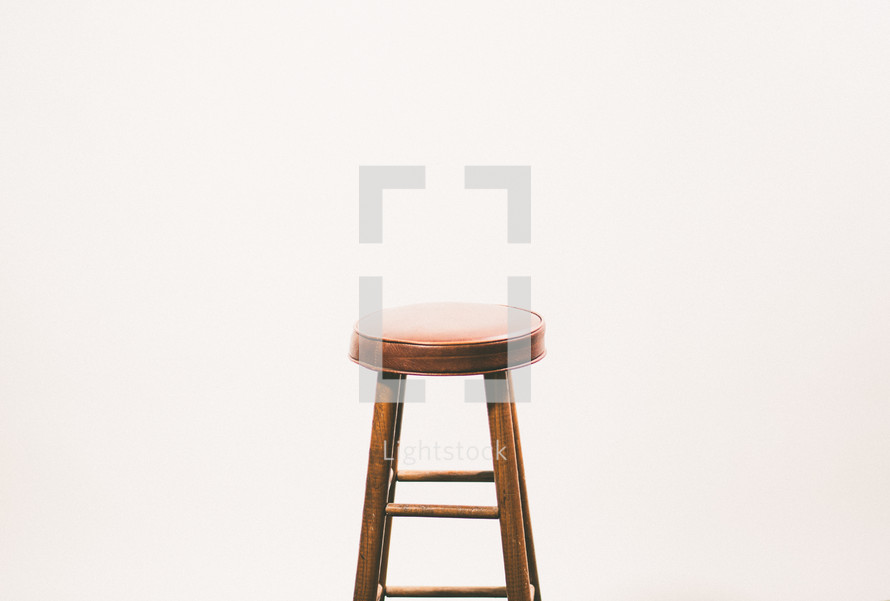 a stool in an empty room 