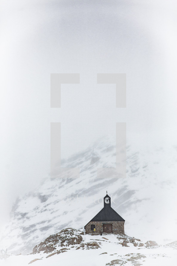 rural church on a snow covered mountainside 