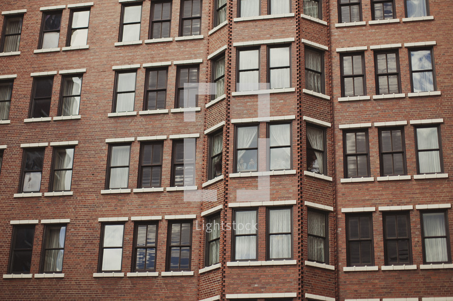 Windows of a brick apartment building