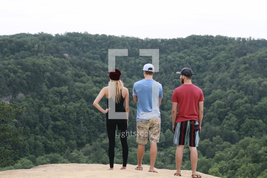 friends looking out over a mountain 