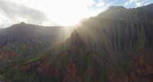 sunbeams over rugged cliffs on a mountainous island landscape 