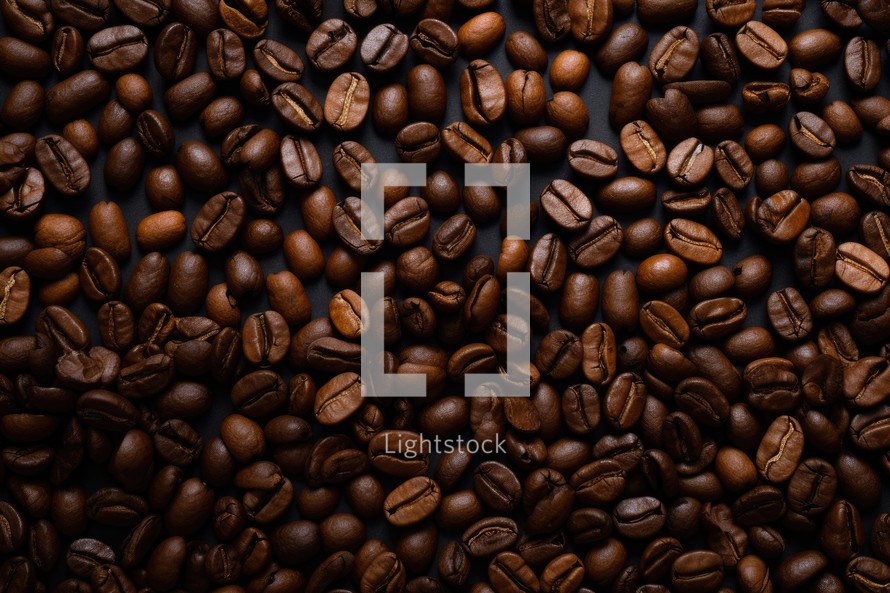 coffee beans on a dark background, can be used as a background