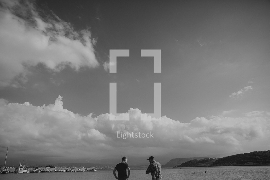 men standing on a beach in Greece 