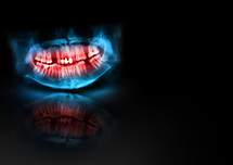 Blue and red x-ray teeth jaw skull with glow, shadow and reflection on black background. Panoramic negative image of facial man. Medical design element sample blank template horizontal paper size A4. Panoramic radiograph is a scanning dental X-ray of the upper jaw maxilla and lower jawbone mandible. Black background with with glow, shadow and reflection. Medical horizontal design template for text