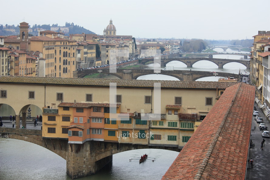 houses on bridges over water in Italy 
