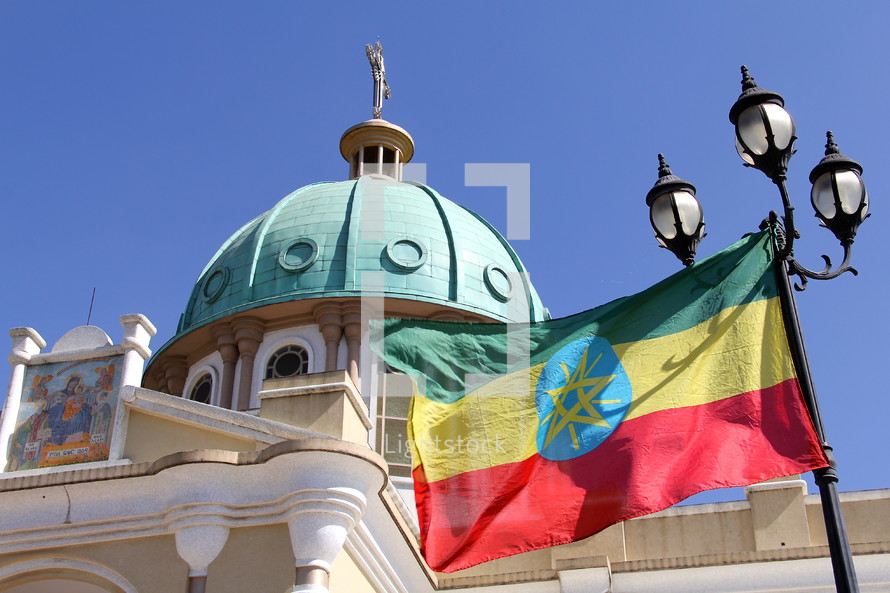 Ethiopian Orthodox cathedral and national flag. 