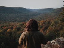 looking out over a fall forest in a valley 