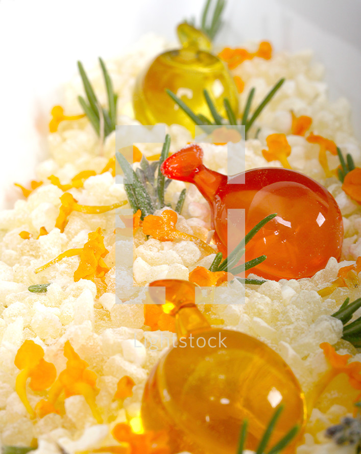 Yellow salt bath with soap and tufts of grass