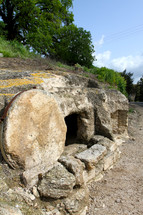 Empty tomb with the stone rolled away in Israel