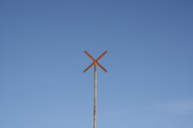 single pole with x on top  - sky