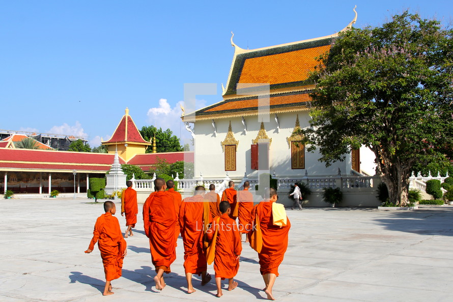 Buddhists monks in orange robes