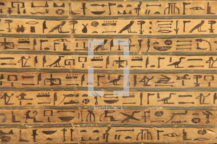 Egyptian hieroglyphics painted onto a stone tablet