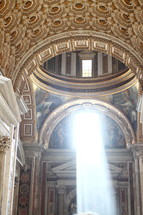Sun streams through a window in St. Peter's Basilica, Vatican City 