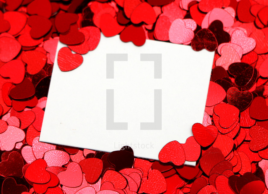 blank white sign surrounded by red hearts 