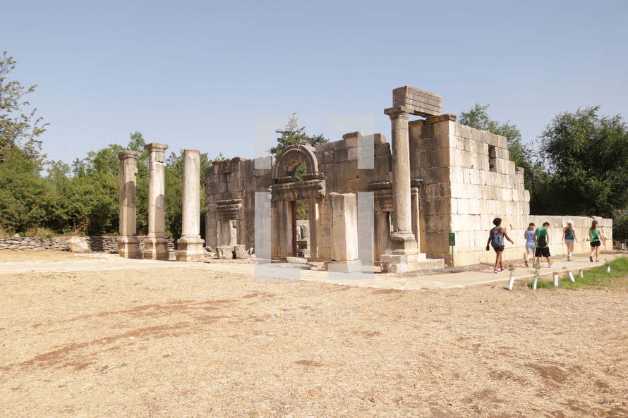 tourists visiting ancient ruins 