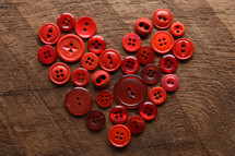 red buttons in the shape of a heart 