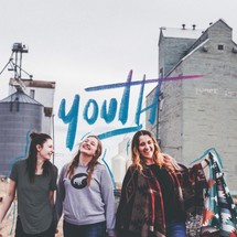 Youth, teen girls in front of silos 