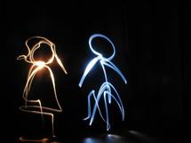 man and woman in lights