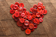 red buttons in the shape of a heart 