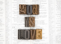 words god is love on the pages of a Bible 