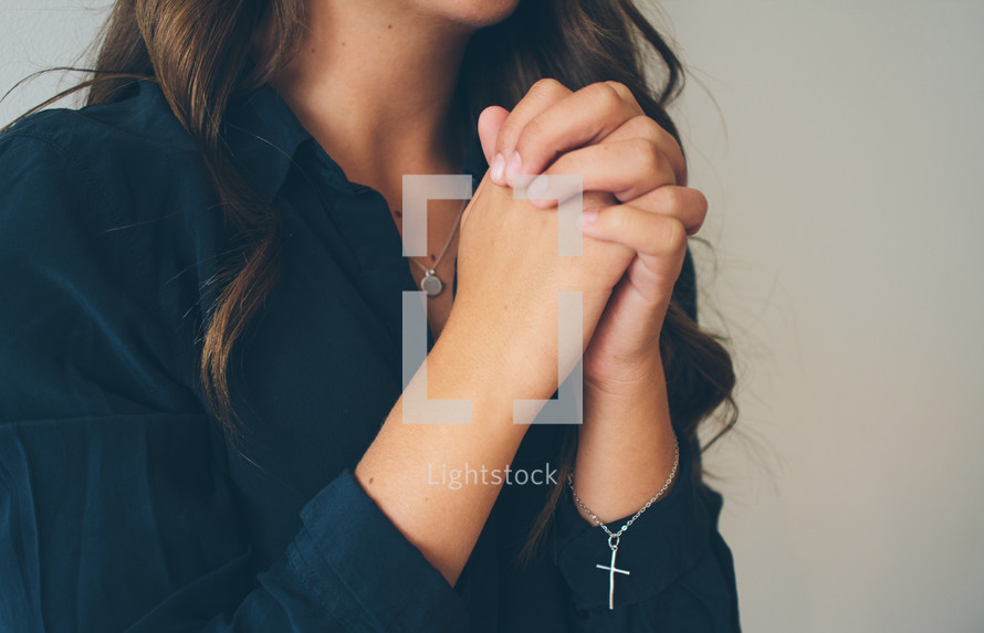 woman with praying hands 