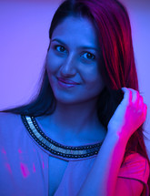 Portrait of woman in purple lighting