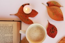 latte, open Bible, fall leaves, candle 