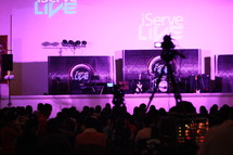 a video camera filming a stage 