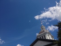 steeple and bell tower in the blue sky 