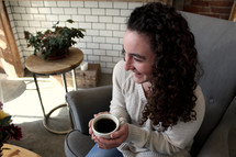 woman holding a coffee cup 