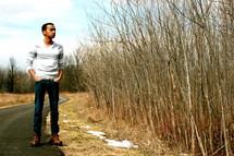 man standing outdoors on a path 
