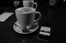 coffee mug and spoon and cellphone 
